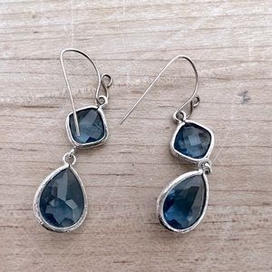 Blue crystal dangling teardrop earrings with silver accents